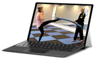 A laptop view of Master Gary Simmons teaching a woman a Taekwondo kick