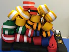 A pile of Taekwondo belts of all different colours