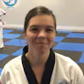 Happy 30 year old woman Master Gary Simmons Traditional Taekwondo student