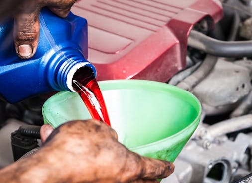 Transmission Tune-Up Service - Richmond VA Adding Transmission Fluid To a Vehicle.