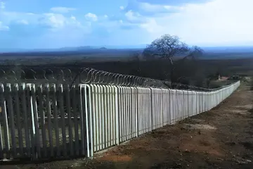 Long concrete palisade fence installed on a farm by Classy Creations in Limpopo