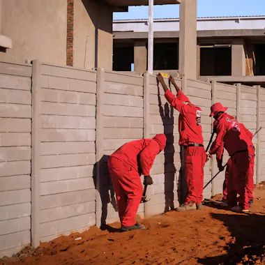 Classy Creations employees repairing a precast wall