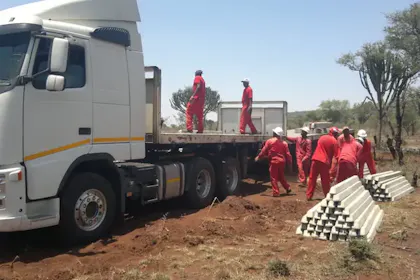 Classy Creations team offloading concrete palisade fencing materials for installation in Limpopo
