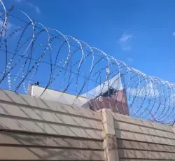 Razor Wire on top of a precast wall installed by Classy Creations
