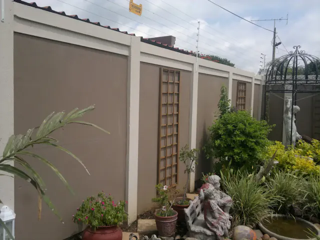 Classy Crete transformed precast wall to look like a modern plastered wall