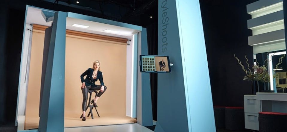 Veras Studio with Vera sitting in chair in front of StyleShoots Live in West End