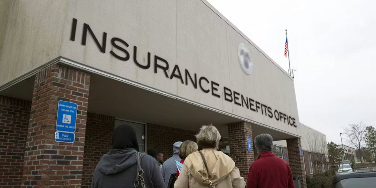 Homeowners reviewing home insurance savings on a laptop