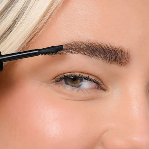 Younique Bare-You Eye Brow Gel being applied with precision brush