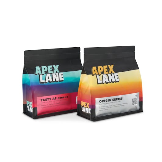 Two coffee packages placed side by side, photographed in a Brisbane studio to showcase branding and product details