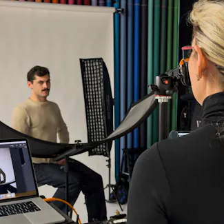 Behind the scenes of a professional acting headshot session in Brisbane with photographer guiding actor through different emotional expressions.