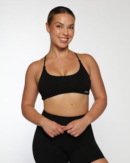 Female model wearing a fitted black activewear top photographed in Brisbane by VERAS Studio