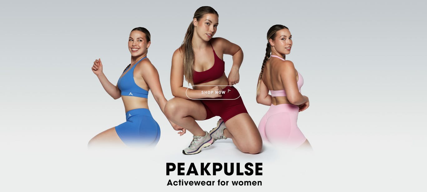 Studio shot of a model in red, blue and pink cropped sports tops photographed at VERAS Studio Brisbane