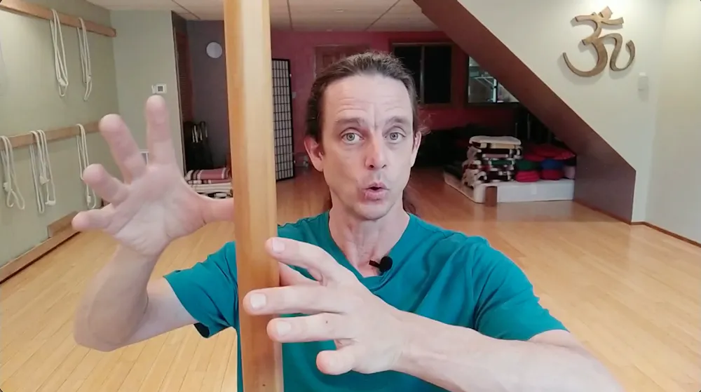 Christian balancing a pole in his studio