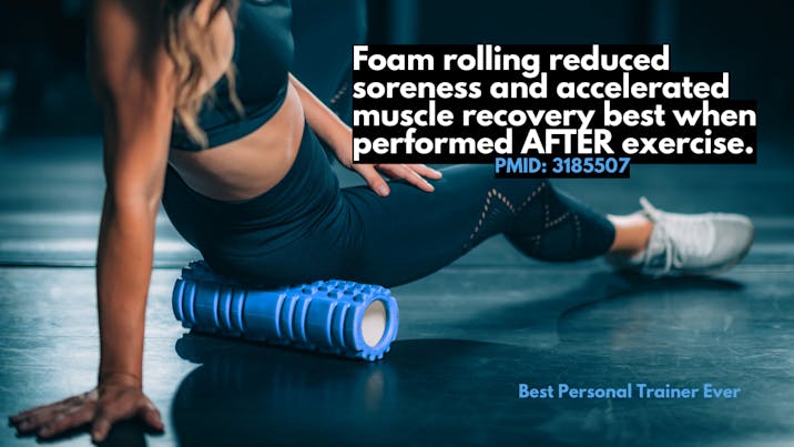 fit woman foam rolling glutes