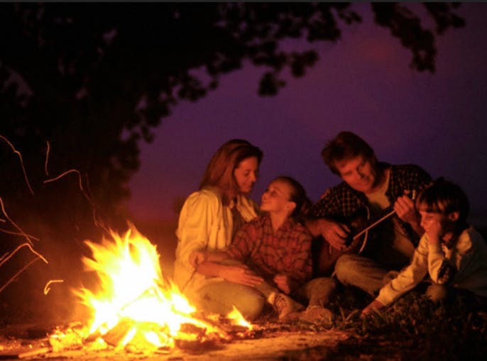 family by camp fire