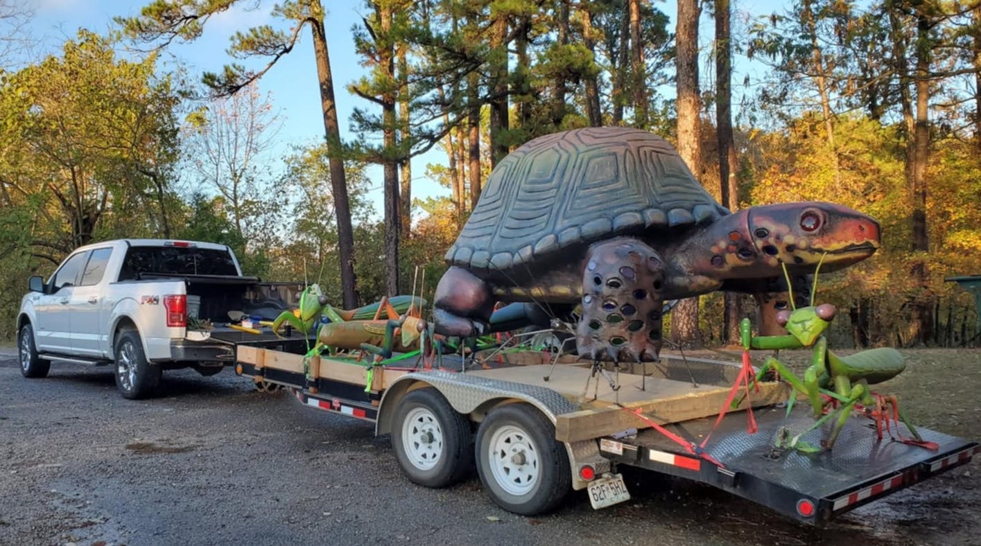giant turtle and bug sculpture delivered