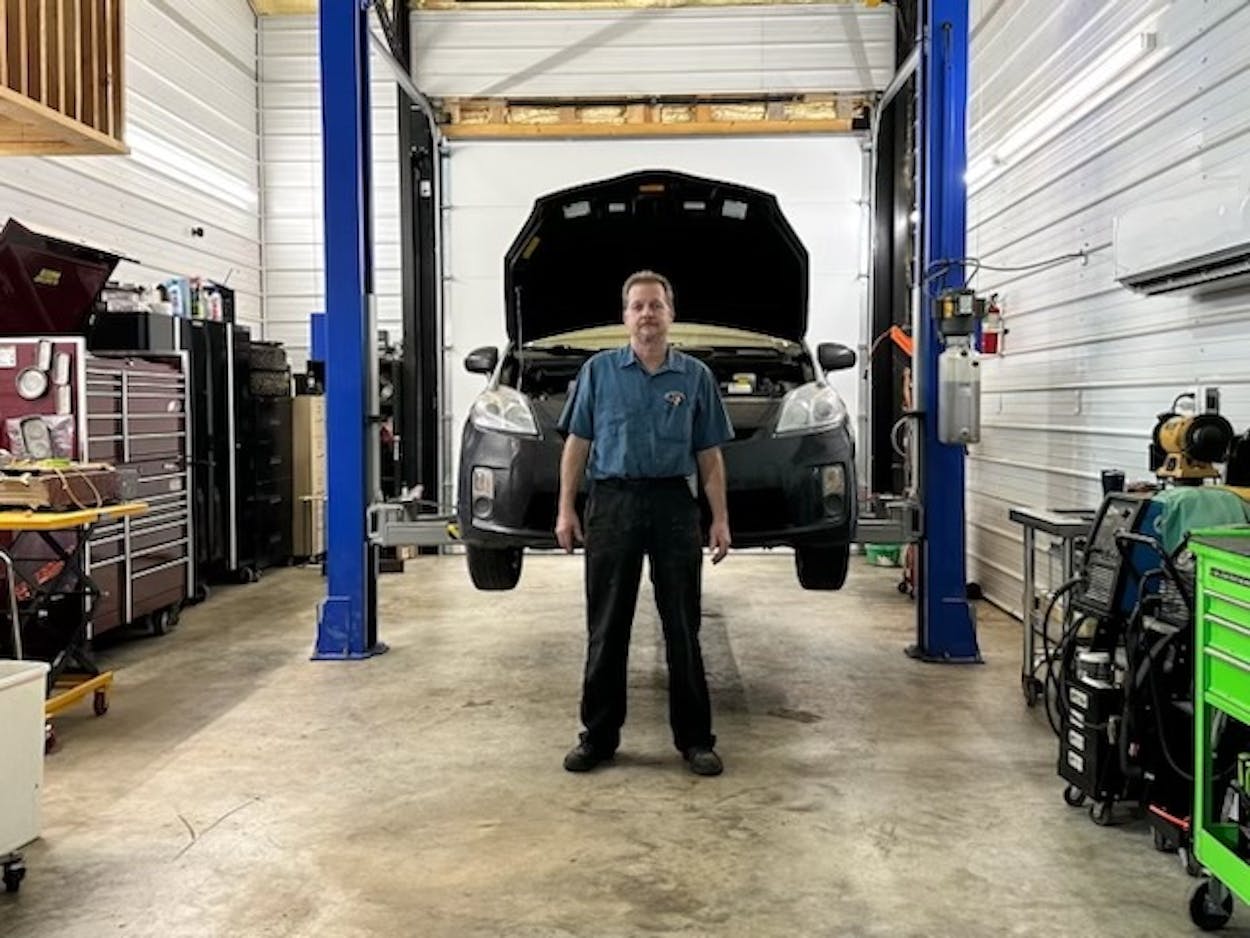 hybrid car mechanic in shop