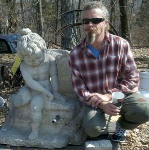 stone carving with sculptor