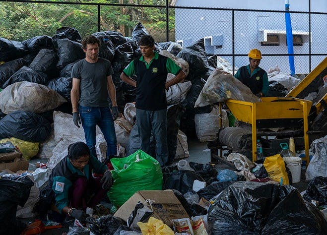 Joe visiting the facility in Goa, India where the recovered waste is sorted and processed